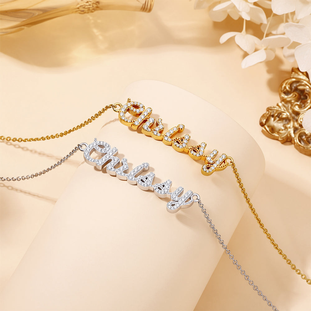 CASA London Custom Pavé Name Necklace shown in both finishes, 18ct gold vermeil and rhodium silver, crafted on an S925 sterling silver base with hand-set moissanite stones.